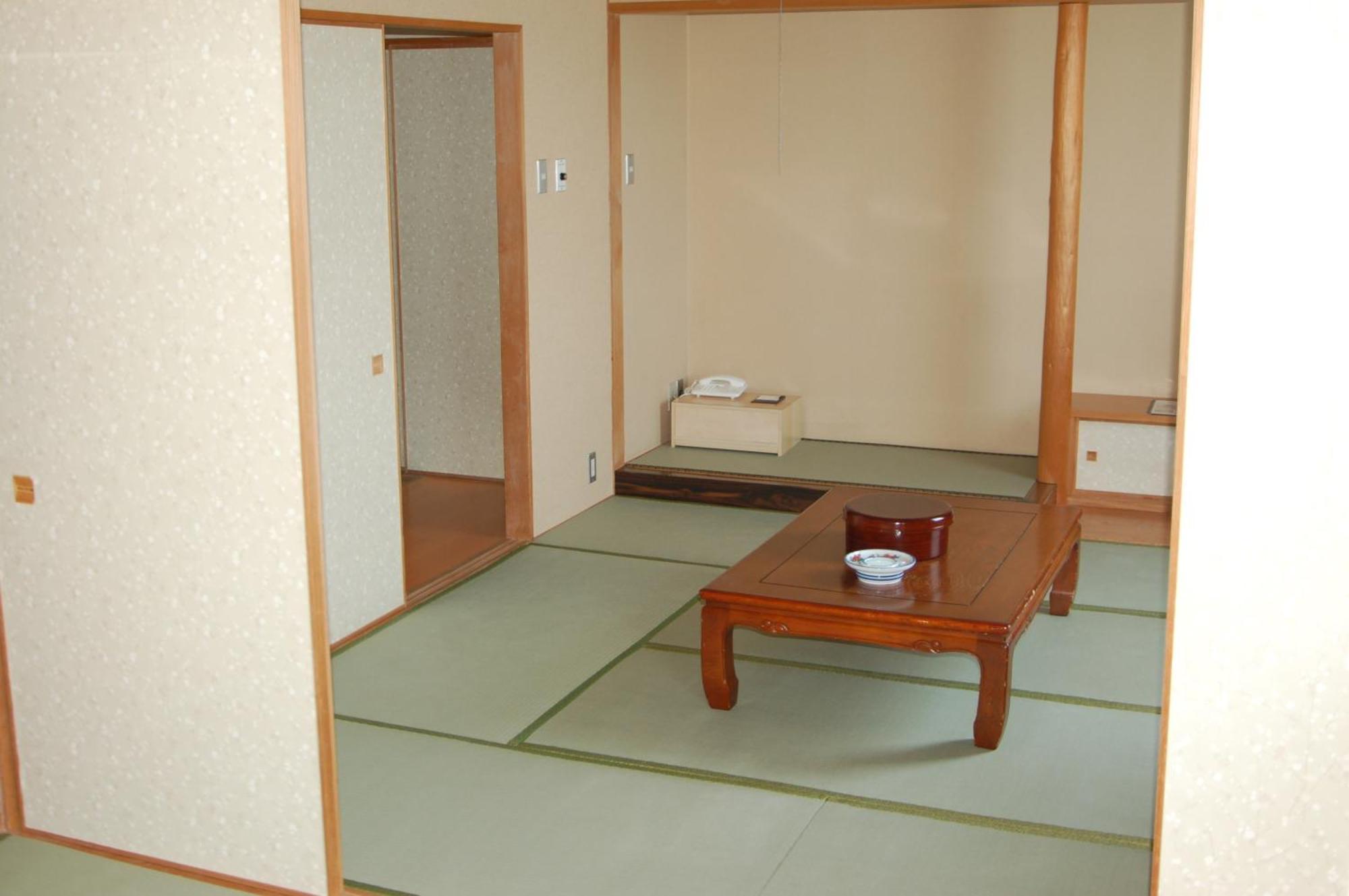 Shizunai Eclipse Hotel Синхидака Номер фото