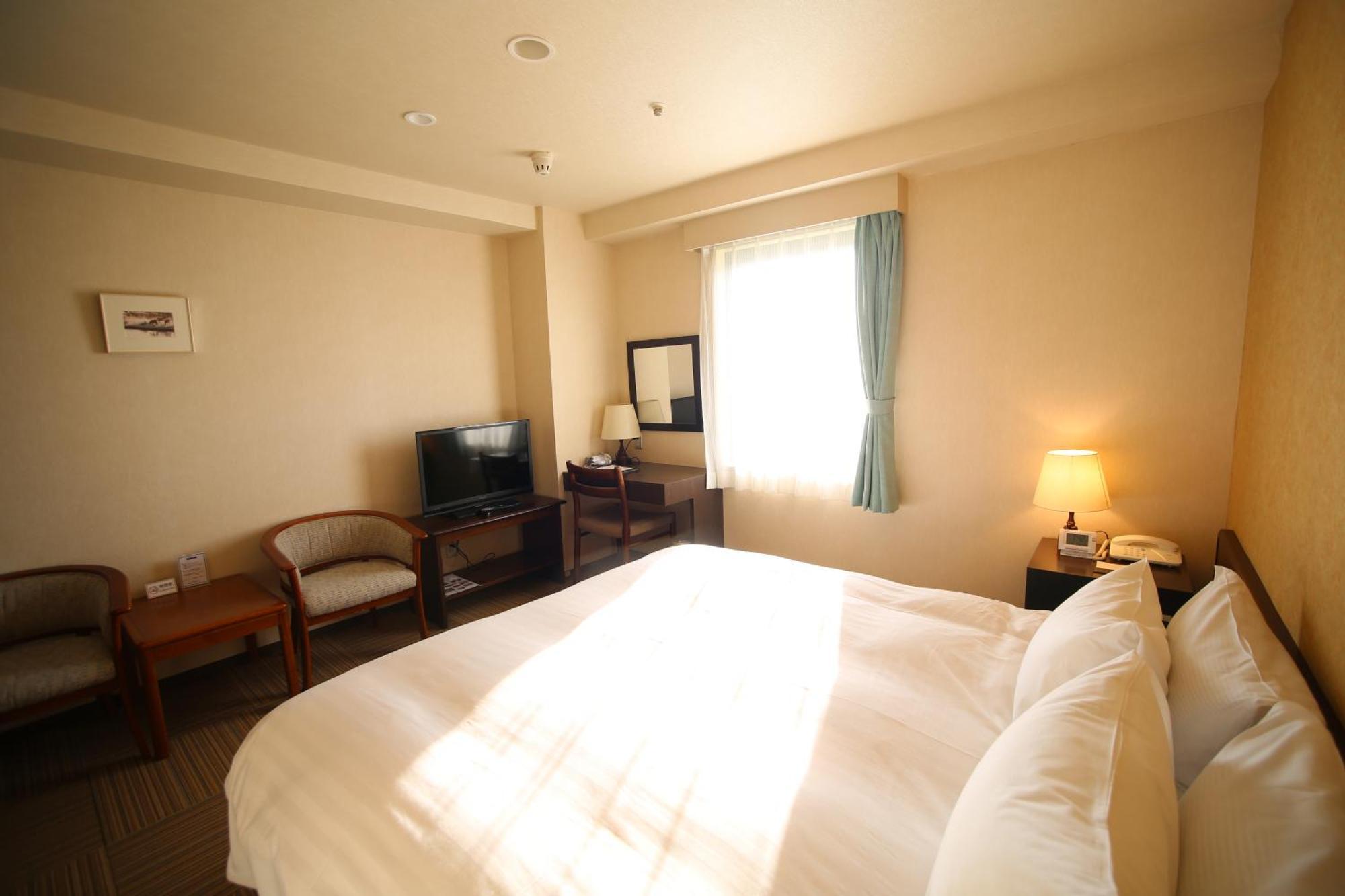 Shizunai Eclipse Hotel Синхидака Номер фото